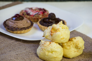 chocolate, strawberry and cream pies. space for text