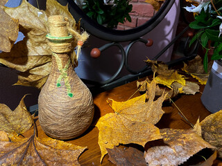 beautiful autumn leaves on a table with a mirror
