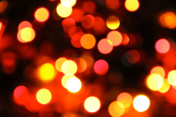 Abstract of gold background. Bokeh light. shimmering blur spot lights on multicolored abstract background. Red pink yellow orange magenta. Christmas holiday