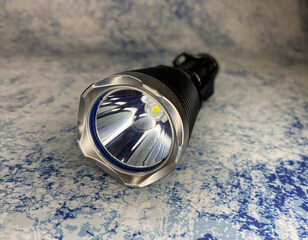 tactical flashlight with steel bezel