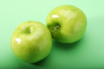 Green apples on green background