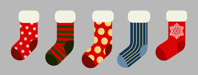 Christmas and New year holiday traditional colorful socks with holiday patterns. Deer and Santas helpers elves on present warm winter stockings and candy strips flat vector isolated icon set.