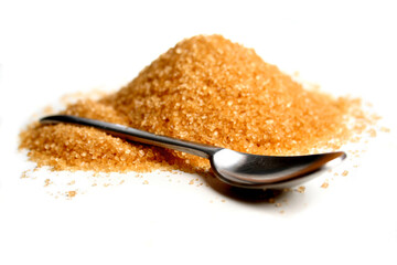 Brown sugar and spoon on white background