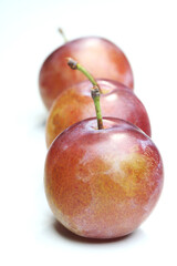 Plums on white bacground - close-up