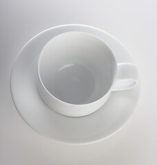 Empty cup on white background - studio shot