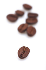 Coffee grains on white background
