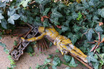 Historic Statue on the autumn mystery old Prague Cemetery, Czech Republic