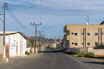 Street with mosque in the town Al Ais, Saudi Arabia