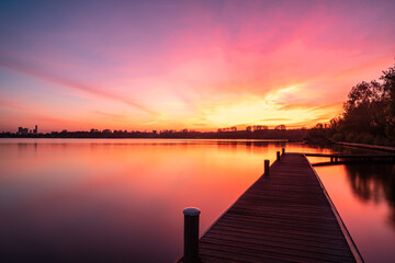 Fototapeta na wymiar Pink sunset over Kralingen lake in Rotterdam