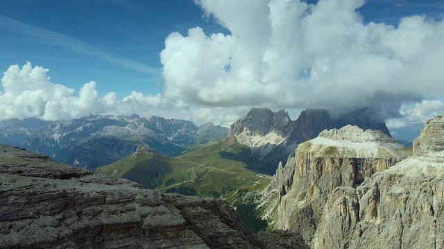 Aerial view from the top of the mountain to the neighboring mountains. Italian Dolomites. View from Piz Boe mountain on Langkofel. Stunning aerial view.