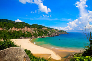 Fototapeta na wymiar South Vietnam. Nha Trang. Blue lagoon. Beautiful landscape with sandy beach, turquoise water and green hill.
