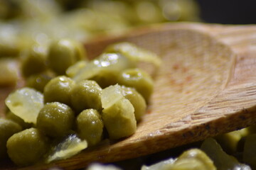 close-up of gravy with peas in a pan