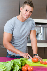 young man in the home kitchen working