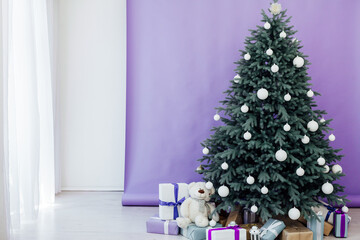 New Year's card interior purple decor and Christmas tree with gifts