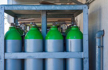 Gas industry, oxygen cylinders and pipes with valves.