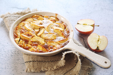 French cuisine. Apple clafoutis in ceramic dish for sweet dessert