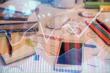 Double exposure of forex chart drawing and cell phone background. Concept of financial data analysis