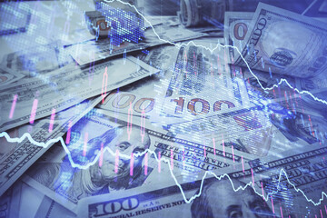Multi exposure of forex chart drawing over us dollars bill background. Concept of financial success...