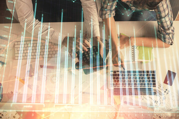 Double exposure of man and woman working together and financial graph hologram drawing. market analysis concept. Computer background. Top View.