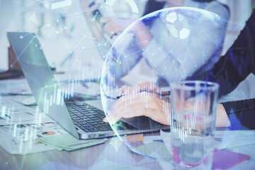 Multi exposure of woman hands typing on computer and forex chart hologram drawing. Stock market analysis concept.