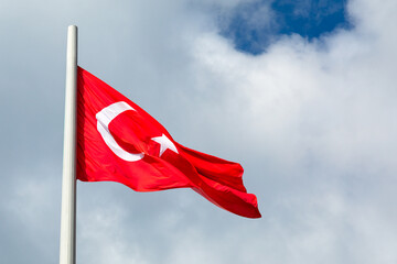 Turkey flag waving in the wind against the sky.