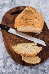 simple food ingredients, homemade australian damper bread without yeast freshly made and on top of cutting board