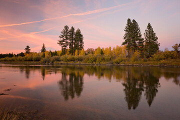 Reflections of fall color along the Deschutes river in Bend, Oregon