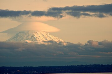 Cloud and Snow capped Mt. Rainier at Twilight