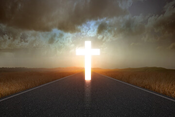 Christian cross at the end of the road