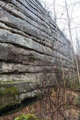 Anyu pillars . Beautiful rocky gray textured background with mosses and lichens. Surface mountain cliff close-up.
