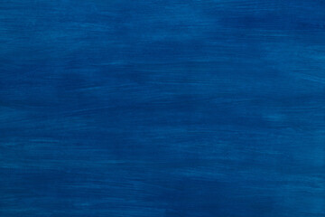 Abstract blue background, painted with gouache on paper. Artistically blurry. Paper texture