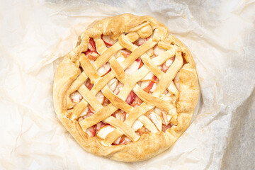 dessert baking concept. apple pie above view on a paper background. studio shot. homemade cooking concept