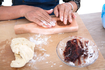 Making moon cakes for the traditional Chinese Mid-Autumn Festival on a cutting board