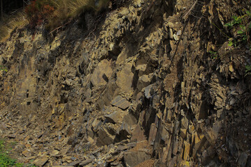 The oblique texture of colorful layered stone of Shale.