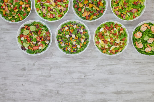 Colorful Fresh Wholesome Salads with Shrimp Edamame, Mediterranean Couscous, Roast Beef, Artichoke Ham, Grilled Chicken & Avocado and Cobb Salads.