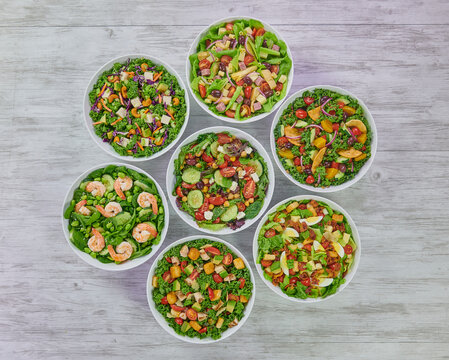 Colorful Fresh Wholesome Salads with Shrimp Edamame, Mediterranean Couscous, Roast Beef, Artichoke Ham, Grilled Chicken & Avocado and Cobb Salads.