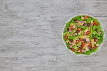 Artichoke Ham Salad with Lettuce, Artichoke, Ham, Grape Tomatoes, Red Onion, Kalamata Olives, White Cheddar, Hearts of Palm