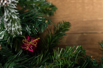 Christmas new year composition on wooden desk background. Fir branches, christmas decoration. Flat lay, top view, copy space