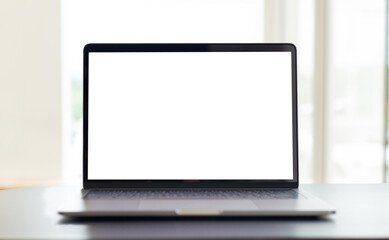 computer blank screen mockup.laptop with white background for advertising,contact business search information on desk at coffee shop.marketing and creative design