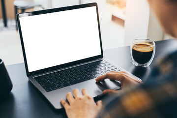 computer blank screen mockup.hand woman work using laptop with white background for advertising,contact business search information on desk at coffee shop.marketing and creative design