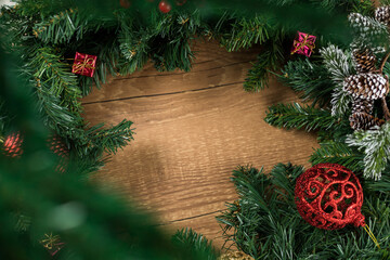 Christmas new year composition on wooden desk background. Fir branches, christmas decoration. Flat lay, top view, copy space