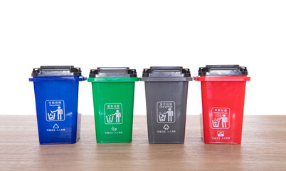 Four different color garbage bins