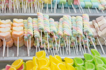 Colorful Marshmallow candy on sticks street food thailand.