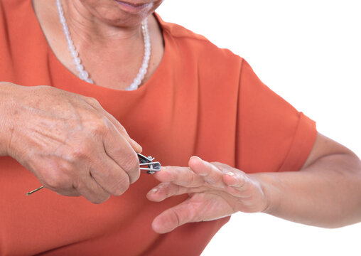 Closeup of Chinese women manicured nails in front of white background