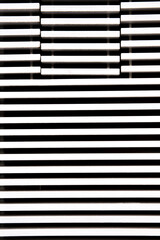 A wooden wall with white striped pattern.
