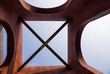 Top structure of a red brick arcade.