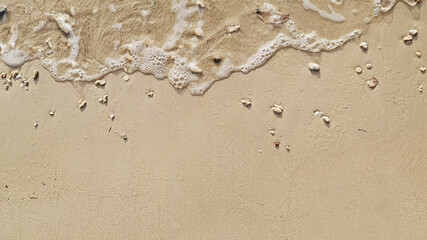 Wave of the sea on the sand beach