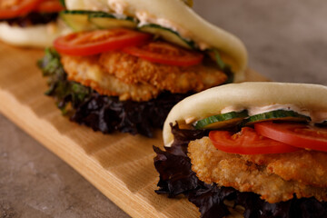Steamed wheat bun dressed with designer sauce. Vietnamese cuisine concept. Still life. Close-up.