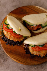 Steamed wheat bun dressed with designer sauce. Vietnamese cuisine concept. Still life. Close-up.