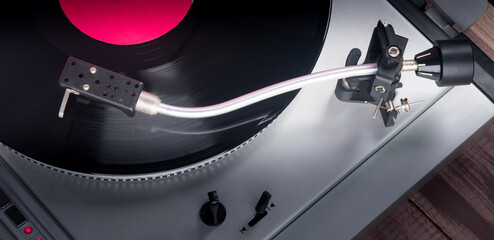 close-up of music player, vinyl records, top view, with illuminated element